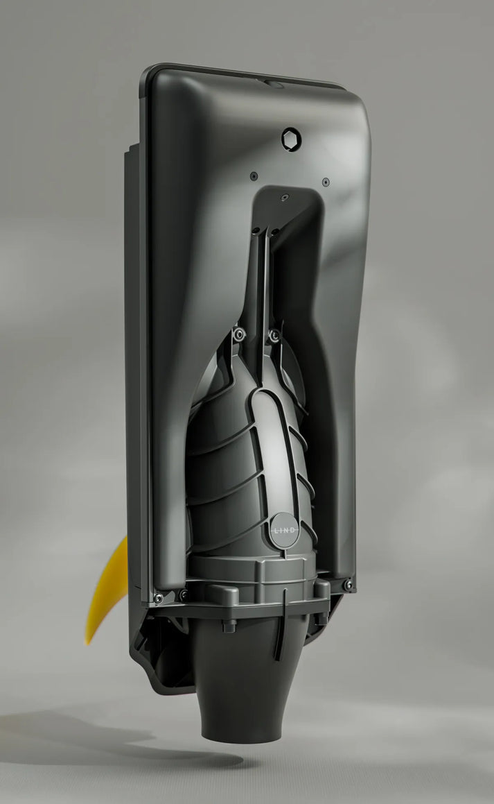 A black motor for the LIND Canvas electric surfboard with a yellow fin.