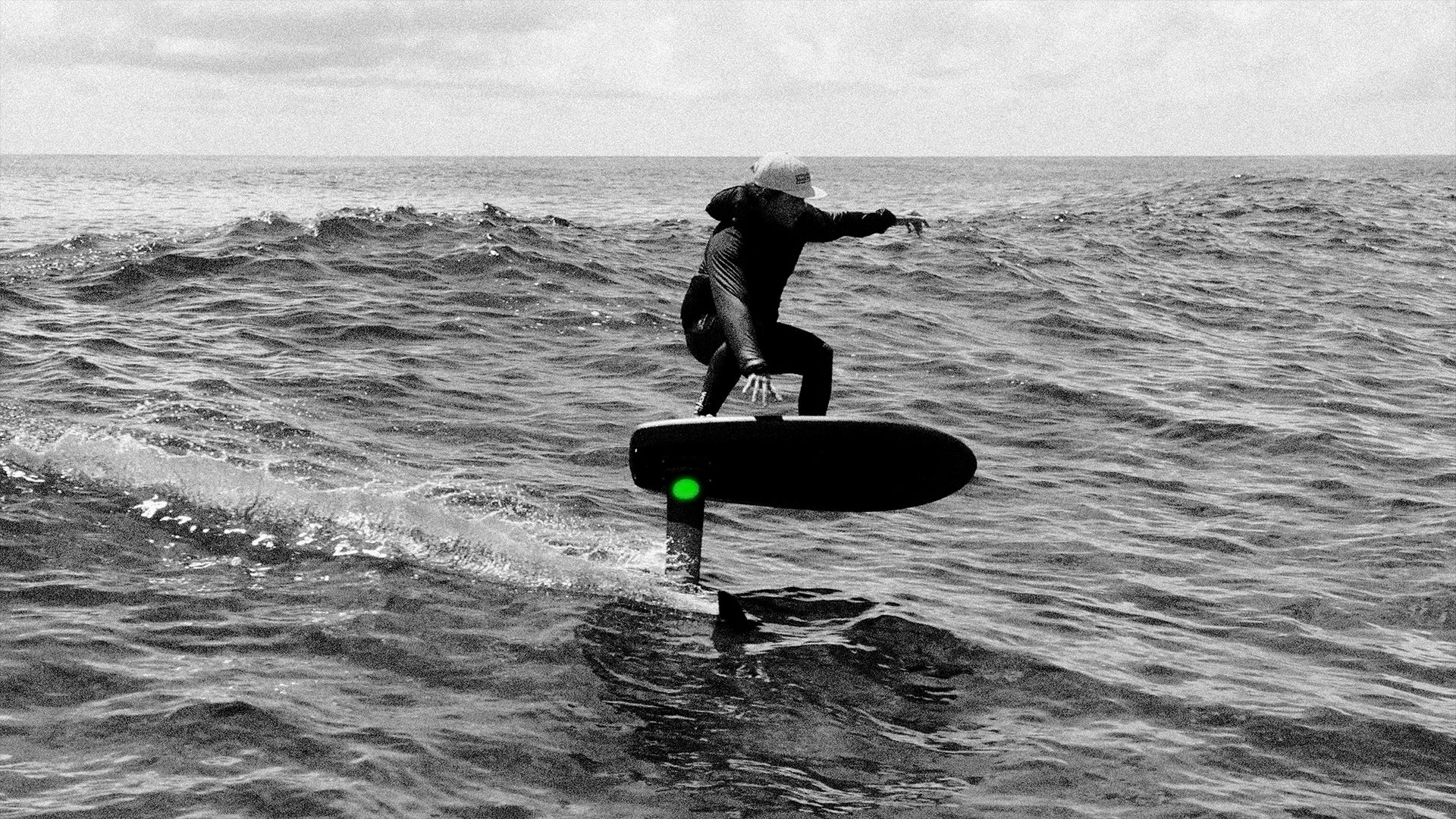 Person riding a Flitelabon water with a cloudy sky
