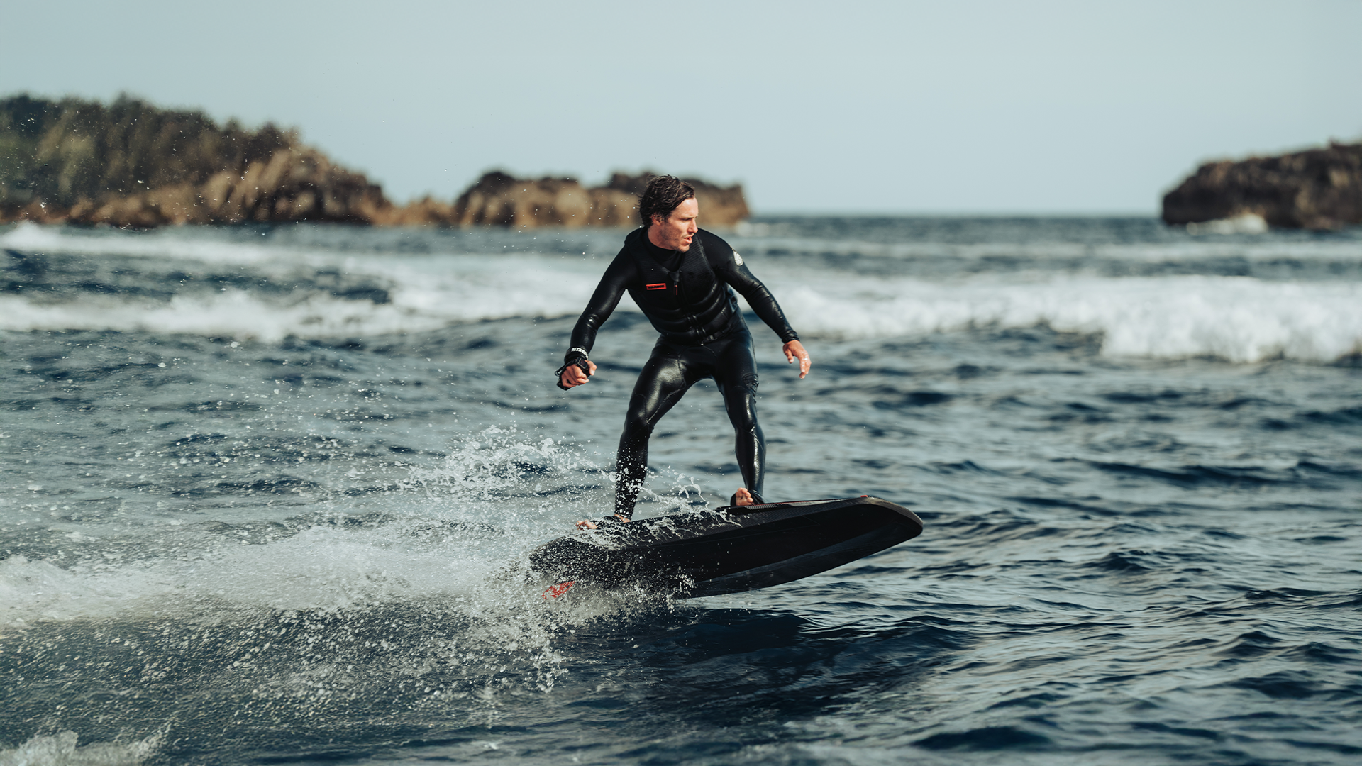 A man rides an awake x brabus jetboard on the sea.
