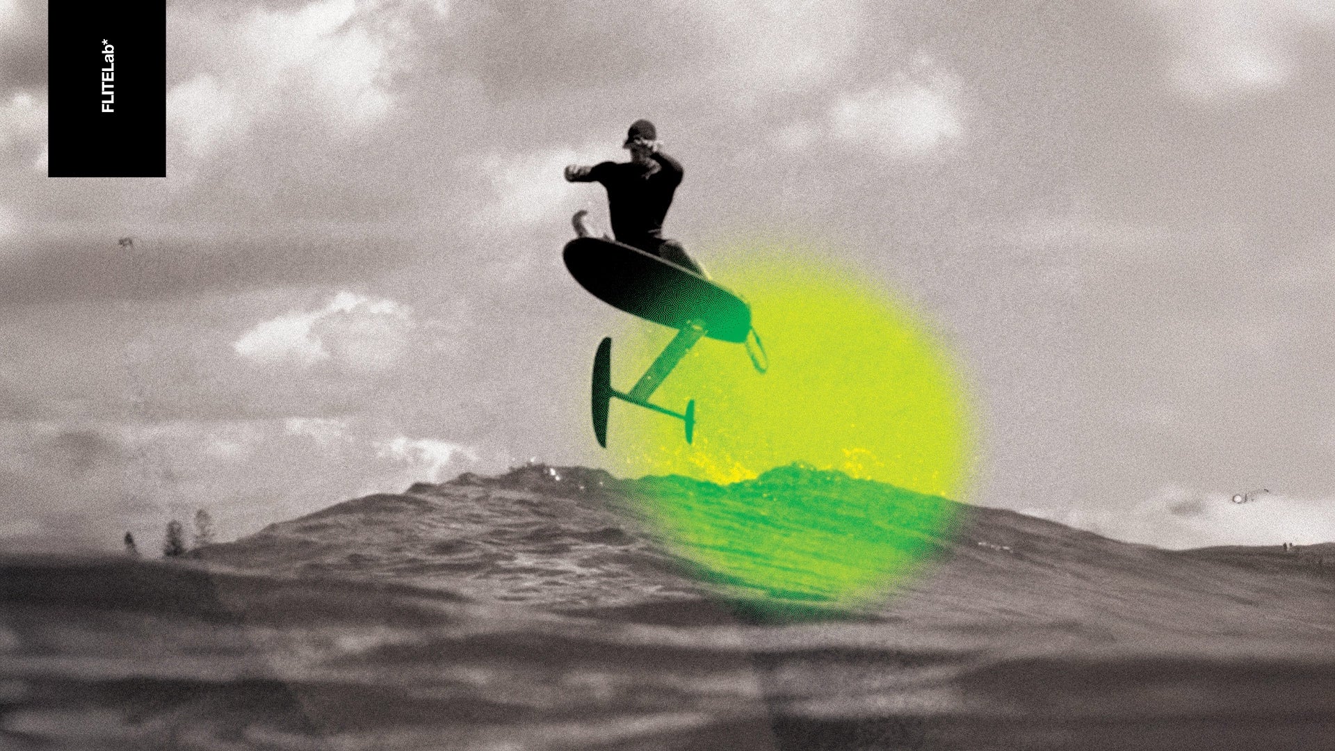 Person on a FliteLab surfboard jumping out of the water.