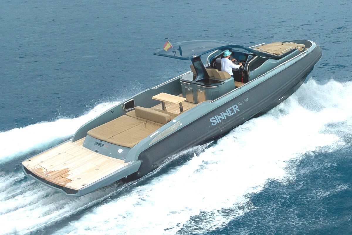 Gray sinner speedboat branding on a body of water.
